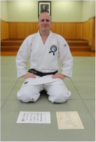 The Brazilian Judoka Vinícius Erchov Is Awarded a Certificate at Kodokan